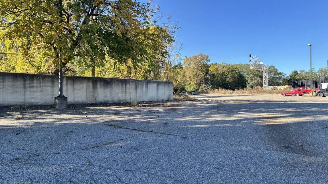 Cleared lot along a wall