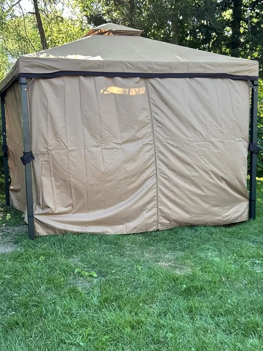 Assembled gazebo with curtains