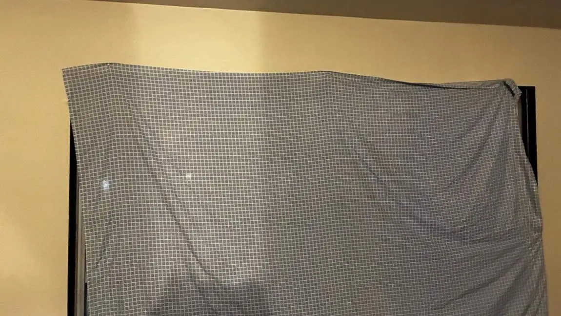 Sheet pinned over a window